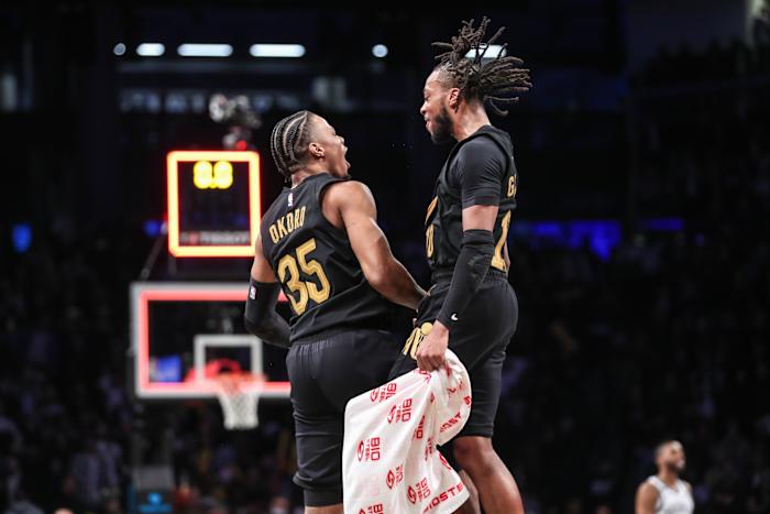 Mar 23, 2023; Brooklyn, New York, USA; Cleveland Cavaliers forward Isaac Okoro (35) celebrates with guard Darius Garland (10) after scoring the game wining basket to beat the Brooklyn Nets 116-114 at Barclays Center. Mandatory Credit: Wendell Cruz-USA TODAY Sports